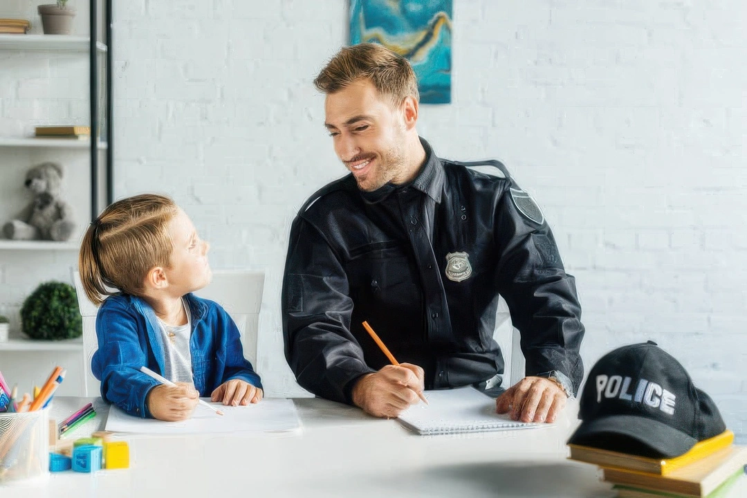 police first responder with child laughing